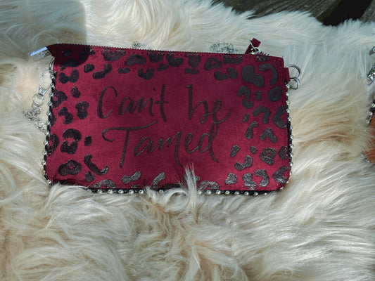 Can’t be tamed clutch purse